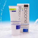 The packaging indicates it 'Boosts the rate of hair growth', 'Fortifies the hair with essential nutrients and proteins', and 'Contains mild ingredients, making it safe for daily use