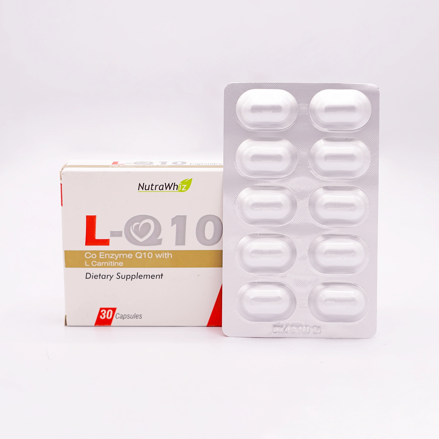 NutraWhiz L-Q10 Dietary Supplement, Co Enzyme Q10 with L Carnitine, 30 Capsules, in a white box with a prominent red heart graphic and bold black lettering, and a silver blister pack containing 10 capsules, set on a white background.
