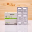 NutraWhiz Osteowhiz Calcium Magnesium Vitamin D & Zinc tablets, 30 tablets, in a white and green box and a blister pack of 10 white, oval-shaped tablets, set against a light wood background.