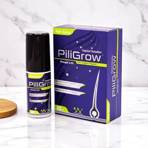 PiliGrow Hair Spray with hair support program details on its box.